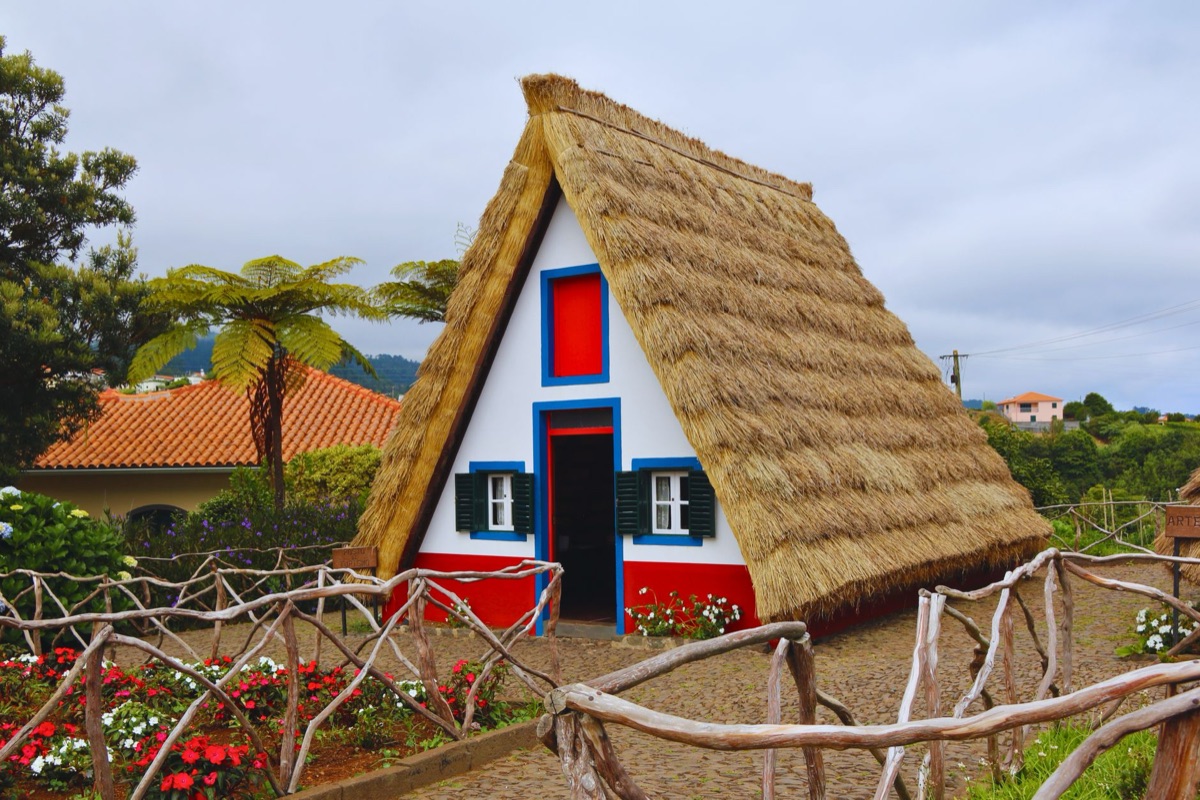Island with cultural landmarks and traditional houses in the distance