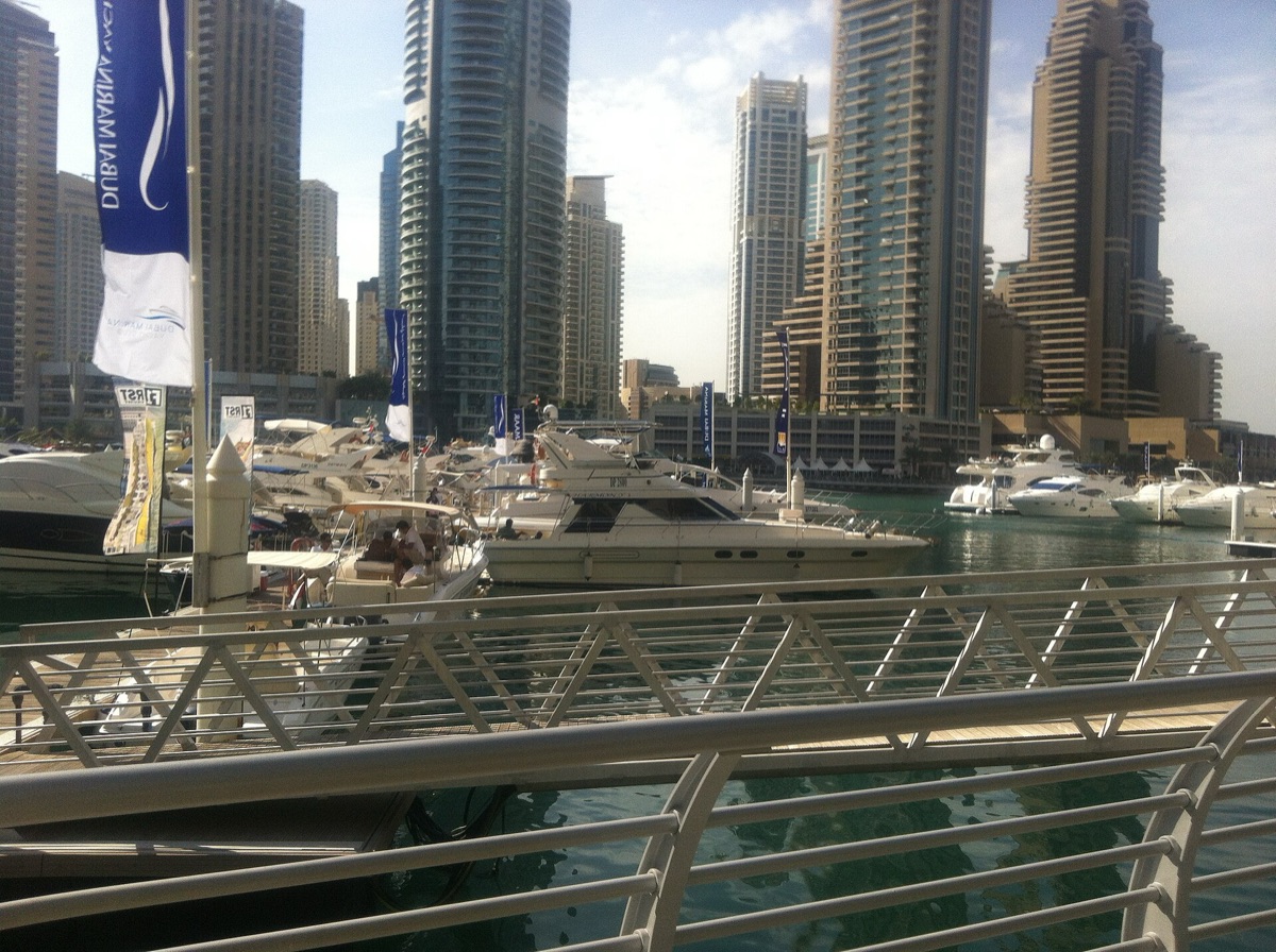yacht and speedboat at marina
